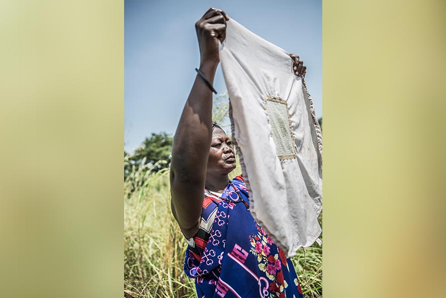 Woman holds up a filter cloth.